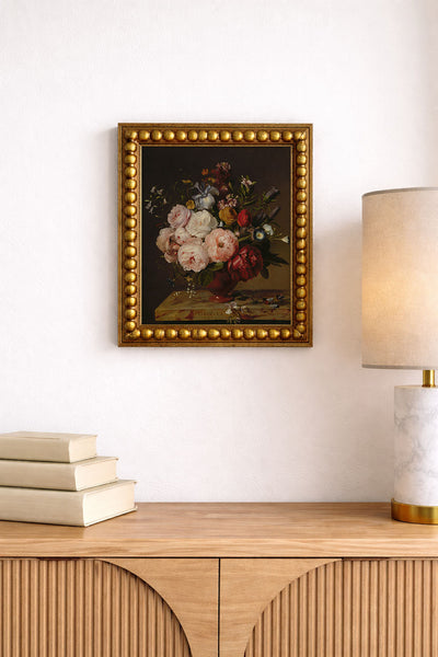 A Vase of Flowers on a Ledge