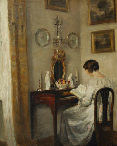 AN INTERIOR WITH A GIRL READING AT A DESK
