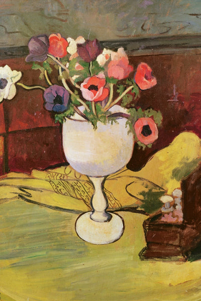 ANEMONES IN A WHITE GLASS