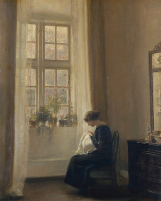 GIRL SEWING IN AN INTERIOR