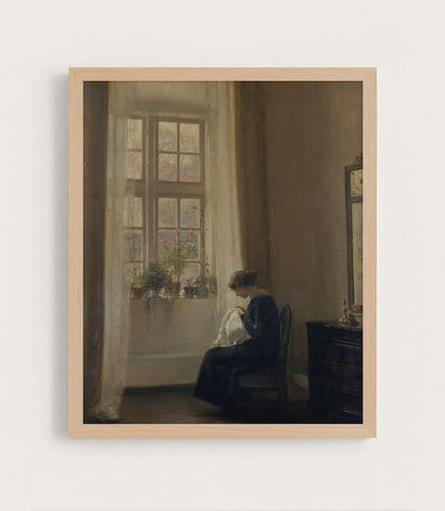 Girl Sewing in an Interior