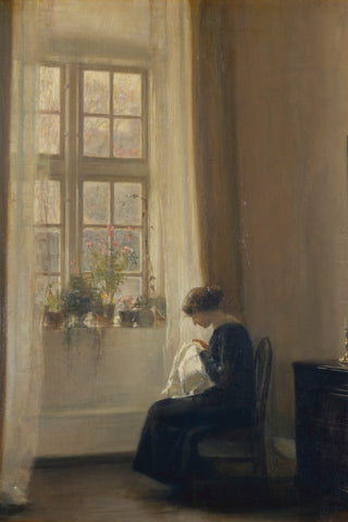 GIRL SEWING IN AN INTERIOR