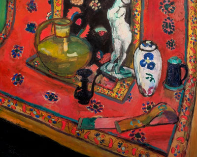 STATUETTE AND VASES ON AN ORIENTAL CARPET