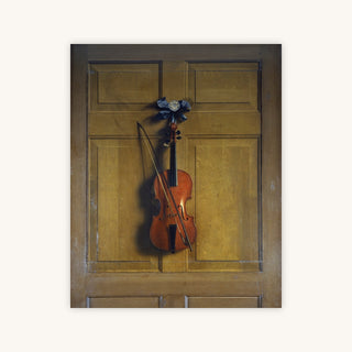 VIOLIN AND BOW HANGING ON A DOOR — Primary Image