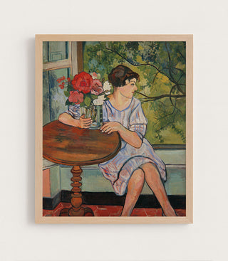 YOUNG GIRL IN FRONT OF A WINDOW