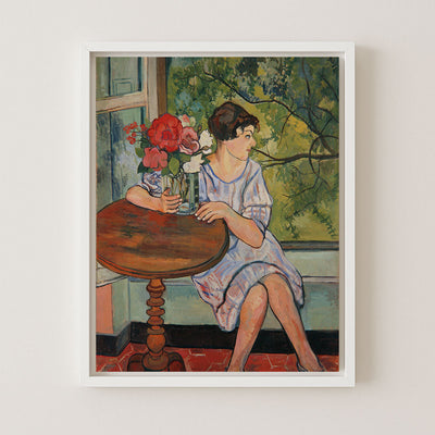 YOUNG GIRL IN FRONT OF A WINDOW