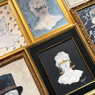 Framed artworks of classical sculptures with gold frames