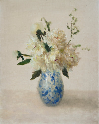 WHITE FLORAL IN A BLUE AND WHITE VASE